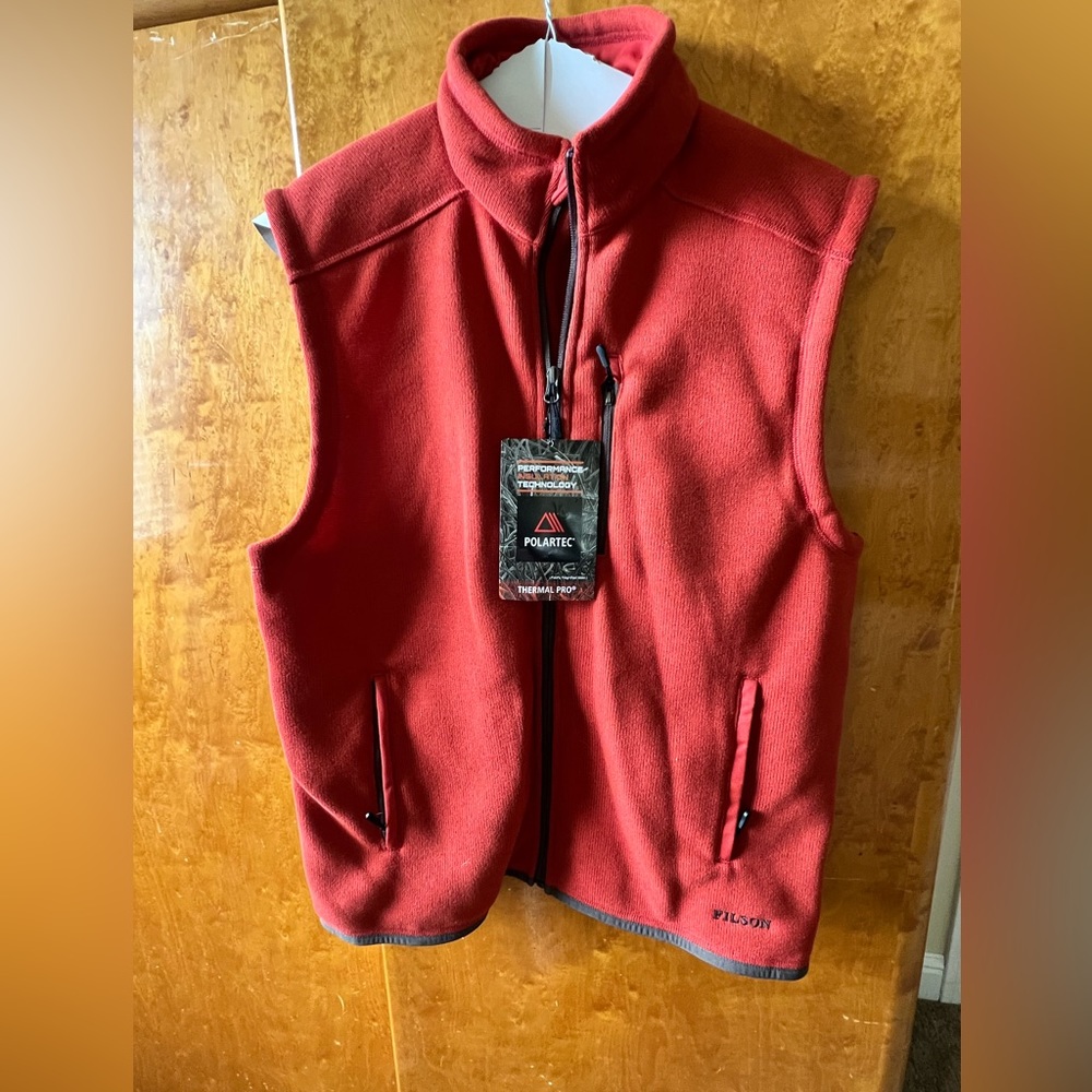 New with tags. Men’s size Medium Filson Vest. Burnt Orange in color.